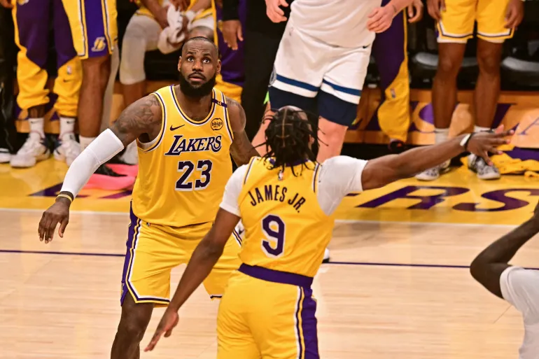 LeBron and Bronny James share court, make NBA history as Lakers beat Wolves