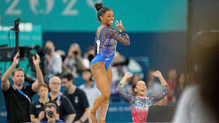 Simone Biles shares playful, flirty selfies in bedazzled gold leotard